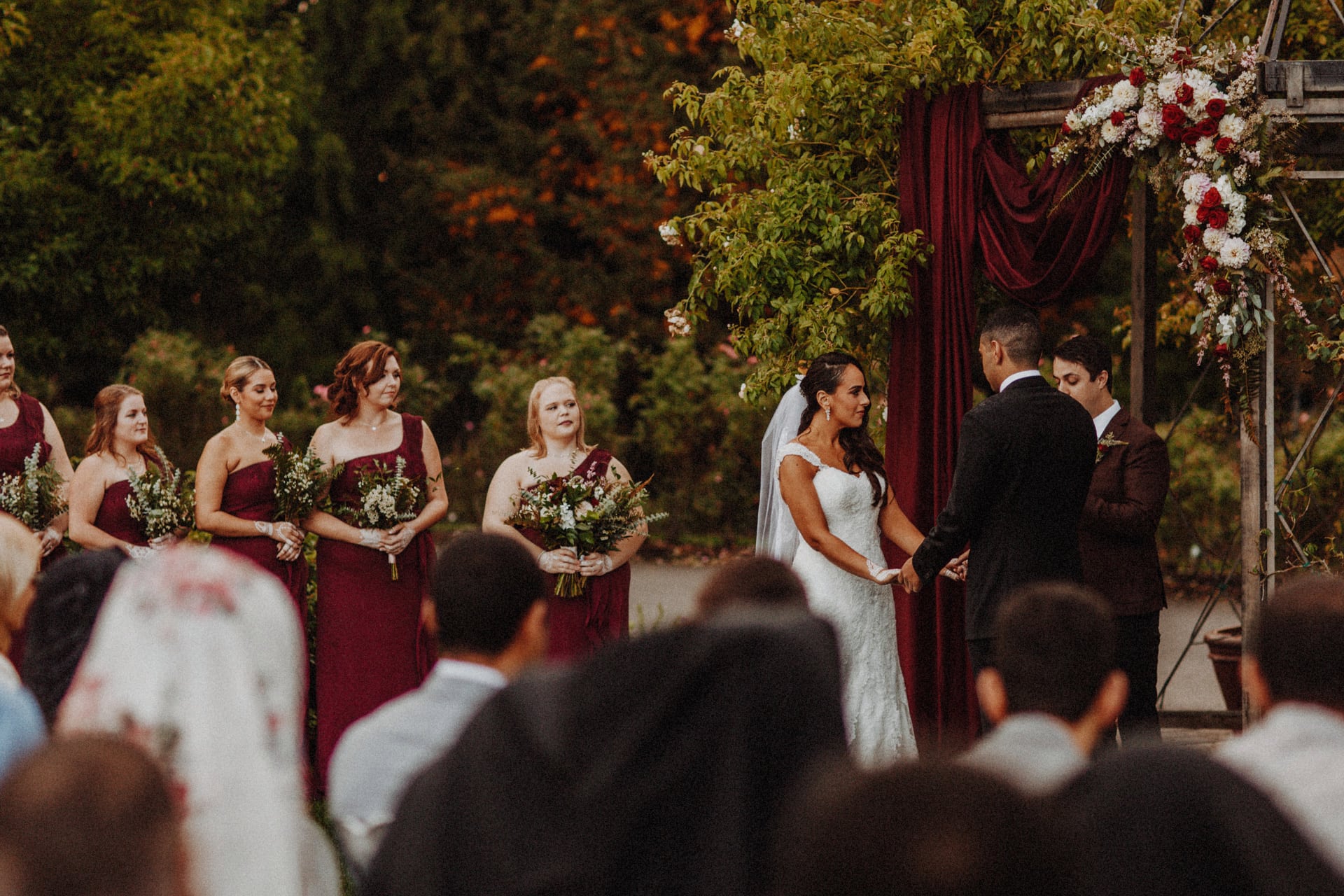 a bride and her birdesmaids exchanging vows at the Oregon Garden Resort in Oregon